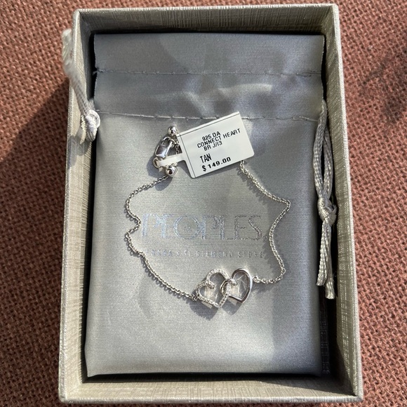 0.04 CT. T.W. Diamond Interlocking Hearts Bracelet in Sterling Silver - 6.75" - Picture 7 of 10